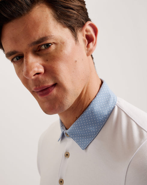 FREND-Tops-We've given the classic polo a remix. Crafted from a soft viscose blend, this sharp collared tee with button detail and short sleeves looks great as part of a smart-casual look.This product is made from LENZING™ ECOVERO™ Viscose fibres. LENZING™ ECOVERO™ fibres are derived from sustainable wood and pulp, sourced from certified and controlled forests, with up to 50% lower emissions and water impact compared to generic viscose. LENZING™ and ECOVERO™ is a trademark of Lenzing AG. Classic polo shirt