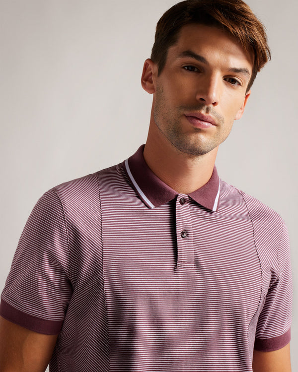TAIGAA-Tops-Not your average polo shirt, TAIGAA kicks things up a notch with its all over striped print and solid trims. Perfect for casual Fridays and city exploring, this shirt teams brilliantly with anything from denim to chinos and beyond.By choosing Ted Baker cotton products, you're supporting our investment in the Better Cotton Initiative's mission. This product is sourced via a system of mass balance and therefore may not contain Better Cotton. Polo shirt 100% cotton Stripe print Regular fit Short sl