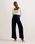 KRISSI-Trousers-The KRISSI wide leg trousers are a must-have item in any wardrobe. Crafted with a high rise and tailored shape, this staple is wonderfully versatile. Team with heels for evening attire, or trainers for elevated street style. Trousers Wide leg High rise Leg pleats Concealed fastening Chae is 5'9.5" / 1.77m and wears Dark Green in a Ted size 1- Ted Baker Romania