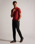 DALDIN-Knitwear-Embrace the effortless sophistication of our DALDIN polo shirt. The classic collar adds a timeless touch to the look, while the zip placket offers a modern twist on traditional design. Polo shirt Rayon Classic collar Zip placket Short sleeves O'Shea is 6'2.5" / 1.89m and wears Dark Orange in a Ted size 3- Ted Baker Romania