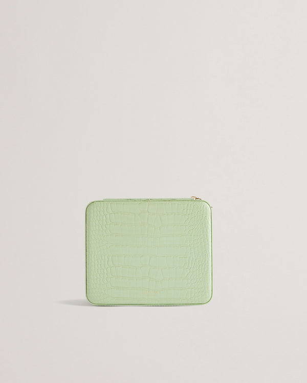 BRENDYY-Gifts-Fit your entire jewelry collection into the BRENDYY case with multiple storage compartments and a handy elasticated pocket. The zip around fastening makes it safe for travelling, and the faux leather outer is finished with a croc effect and branding detail for sleek style. Jewellery case Croc effect Faux leather upper Zip around fastening Multiple compartments Elasticated internal pocket Debossed branded detail Dimensions: 19cm x 23cm x 7cm- Ted Baker Romania