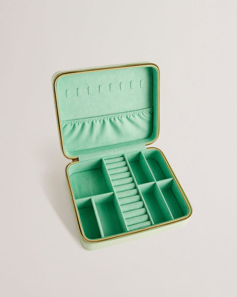 BRENDYY-Gifts-Fit your entire jewelry collection into the BRENDYY case with multiple storage compartments and a handy elasticated pocket. The zip around fastening makes it safe for travelling, and the faux leather outer is finished with a croc effect and branding detail for sleek style. Jewellery case Croc effect Faux leather upper Zip around fastening Multiple compartments Elasticated internal pocket Debossed branded detail Dimensions: 19cm x 23cm x 7cm- Ted Baker Romania