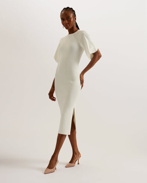 RAELEA-Dresses-The RAELEA midi dress is made to flatter with a soft ribbed knit material and sculpting bodycon fit that shows off your shape. The short, fluted sleeves and split hem add a level of understated glamour that will make this dress your go to for special occasions. Finish your look with a pair of heels and get ready to feel your most beautiful self. Midi dress Sculpting bodycon fit Ribbed knit Short fluted sleeves Side split hem Neckline stitch details Exposed zip fastening Crew neck Lydia is 5'1