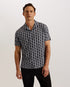 RHIN-Shirts-The RHIN shirt oozes style with its all over T print and textured finish. The relaxed fit and open revere collar bring a more laid back vibe that looks effortlessly cool when paired with classic chinos or shorts. With short sleeves and a linen blend material, it's a comfortable way to dress smarter in the summer months. Short sleeve shirt Textured T print Revere collar Linen blend Button fastenings Relaxed fit Guy is 6'1.5" / 1.87m and wears Black in a Ted size 3- Ted Baker Romania