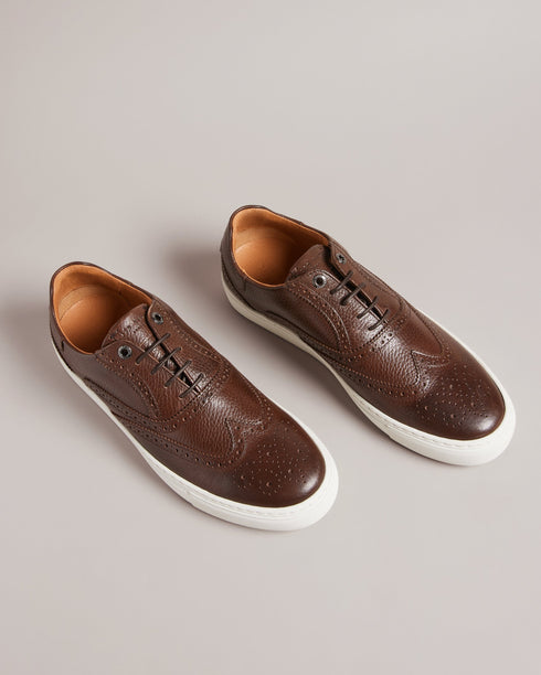 DENTONG-Shoes-Our unique take on the classic brogue shoe, our DENTONG hybrid trainers offer the best of both worlds. With a smooth leather upper, rubber sole, and lace fastening, these shoes are perfect for both casual and formal occasions. Featuring a classically-brogue laser-etched design, they're sure to make a statement wherever you go.By purchasing this product, you are supporting responsible leather manufacturing through the Leather Working Group. Brogue trainer hybrid shoes Smooth leather upper Rubbe