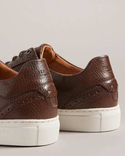DENTONG-Shoes-Our unique take on the classic brogue shoe, our DENTONG hybrid trainers offer the best of both worlds. With a smooth leather upper, rubber sole, and lace fastening, these shoes are perfect for both casual and formal occasions. Featuring a classically-brogue laser-etched design, they're sure to make a statement wherever you go.By purchasing this product, you are supporting responsible leather manufacturing through the Leather Working Group. Brogue trainer hybrid shoes Smooth leather upper Rubbe