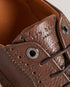 DENTONG-Shoes-Our unique take on the classic brogue shoe, our DENTONG hybrid trainers offer the best of both worlds. With a smooth leather upper, rubber sole, and lace fastening, these shoes are perfect for both casual and formal occasions. Featuring a classically-brogue laser-etched design, they're sure to make a statement wherever you go.By purchasing this product, you are supporting responsible leather manufacturing through the Leather Working Group. Brogue trainer hybrid shoes Smooth leather upper Rubbe