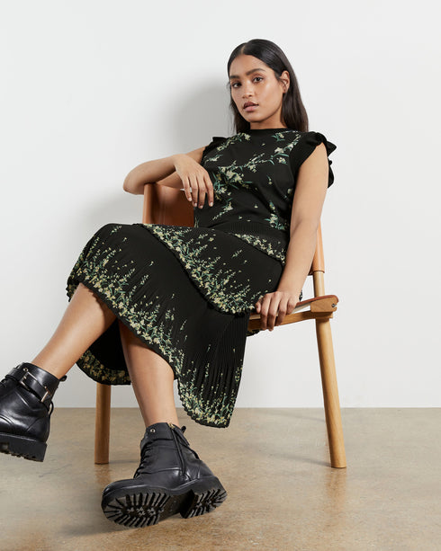 ZAPHIRA-Knitwear-Matchy-Matchy. The Zaphira Top Has Been Made From Lustrous Satin, Overlaid With A Subtle Floral Print. Finished With A Ribbed Hem And Frilled Sleeves In The Same Material, It Shapes And Highlights Your Femininity. We Would Team This Top With The Matching Skirt For The Full Wowser Effect.- Ted Baker Romania