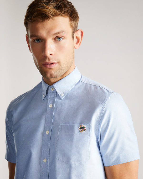 CAPSHO-Shirts-This summer classic is ready to enter your regular rotation. CAPSHO is crafted from a blend of cotton and lyocell — ideal for staying cool in the warmer months. The button-down collar and embroidery detail mean this oxford shirt is smart enough for work, too. By choosing Ted Baker cotton products, you're supporting our investment in the Better Cotton Initiative's mission. This product is sourced via a system of mass balance, and therefore may not contain Better Cotton. Ted Baker menswear col