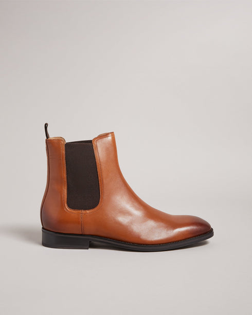 MAISONN-Boots-Step into pure luxury in leather and cotton. MAISONN are a stylish and versatile pair of chelsea boots with timeless appeal. These boots offer a sharp accent to any outfit and are finished with a subtle debossed magnolia on the heel. By purchasing this product, you are supporting responsible leather manufacturing through the Leather Working Group Chelsea boots Leather Pull tab Fully lined Closed round toe Elasticated ankle panel Ted Baker branded- Ted Baker Romania