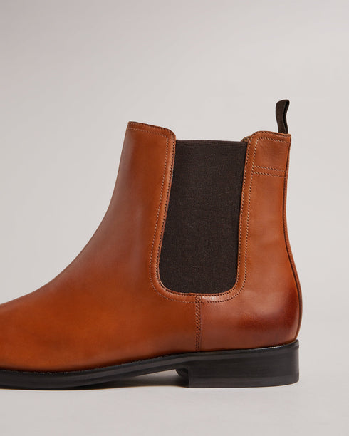 MAISONN-Boots-Step into pure luxury in leather and cotton. MAISONN are a stylish and versatile pair of chelsea boots with timeless appeal. These boots offer a sharp accent to any outfit and are finished with a subtle debossed magnolia on the heel. By purchasing this product, you are supporting responsible leather manufacturing through the Leather Working Group Chelsea boots Leather Pull tab Fully lined Closed round toe Elasticated ankle panel Ted Baker branded- Ted Baker Romania
