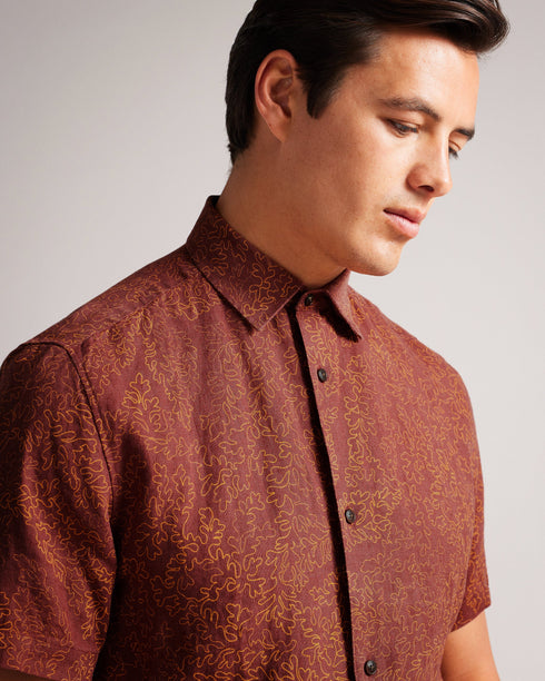 CHAPLN-Shirts-How can CHAPLN look this good? The secret is all in the details: a relaxed fit, short sleeves and an intricate coral print. If you love laid-back style and the comfort of linen, then this shirt is for you.This product is made from European Flax Linen. It is farmed using no irrigation and no pesticides, helping to reduce water and chemical usage. Button up shirt 100% Linen Short sleeved Coral print Classic collar Relaxed fit James is 6'0" / 1.83m and wears Maroon in a size 3- Ted Baker Romania