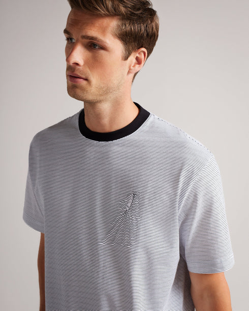 AEGEAN-Tops-Catch the wave and never let it go with AEGEAN. A modern design in a subtle wave pattern makes this stylish summer top unforgettable, while a short sleeve construction keeps it breezy for warm days.By choosing Ted Baker cotton products, you're supporting our investment in the Better Cotton Initiative's mission. This product is sourced via a system of mass balance and therefore may not contain Better Cotton. Graphic T-shirt 100% Cotton Striped graphic print Short sleeved Crew neck Relaxed fit Ell