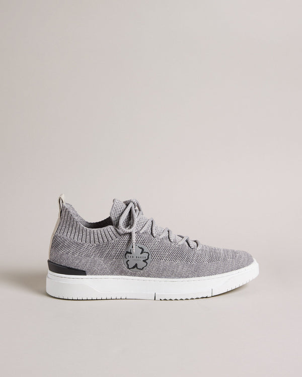 EDMOND-Sneakers-Put your best foot forward in EDMOND. These easygoing trainers have a knitted upper, lace up fastening and magnolia embellishment to keep you looking on point all day long, while the rubber sole provides a comfortable feel underfoot.The upper of this product is made of 100% recycled polyester. Using recycled polyester helps divert plastic waste from ending in landfills. Low top trainers Knitted upper Lace up Magnolia embellishment Rubber sole Ted Baker branded Comes in Ted Baker branded pack