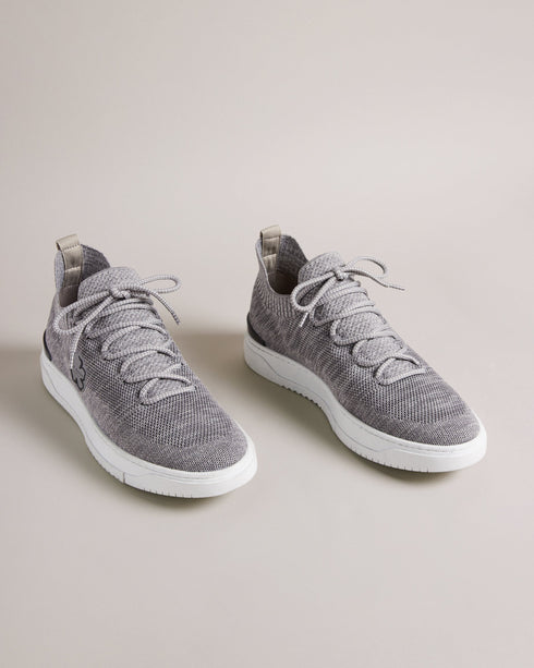 EDMOND-Sneakers-Put your best foot forward in EDMOND. These easygoing trainers have a knitted upper, lace up fastening and magnolia embellishment to keep you looking on point all day long, while the rubber sole provides a comfortable feel underfoot.The upper of this product is made of 100% recycled polyester. Using recycled polyester helps divert plastic waste from ending in landfills. Low top trainers Knitted upper Lace up Magnolia embellishment Rubber sole Ted Baker branded Comes in Ted Baker branded pack