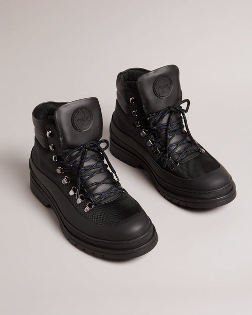 JAKSONN-Boots-Calling all adventure takers. JAKSONN are great shoes for the outdoors that don't compromise on style. The leather and nylon upper gives these boots a more refined look than your average hiking boots, while the rubber sole adds durability and traction. By purchasing this product, you are supporting responsible leather manufacturing through the Leather Working Group. Hiking boots Leather and nylon upper Rubber sole Lace up Ted Baker branded Padded ankle Comes in Ted Baker branded packaging- Ted