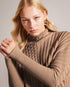 JOILLA-Knitwear-The JOILLA jumper features a funnel neck and long sleeves, with split sides for a unique look. Crafted from a wool and cashmere blend, it is the perfect layer to take you through the winter months. This wardrobe essential works just as well paired with jeans as it does under your favourite leather skirt. The fabric of this product is made with 35% recycled polyamide and 16% recycled wool. Using recycled materials helps divert fabric waste from ending in landfills and reduces our dependence o