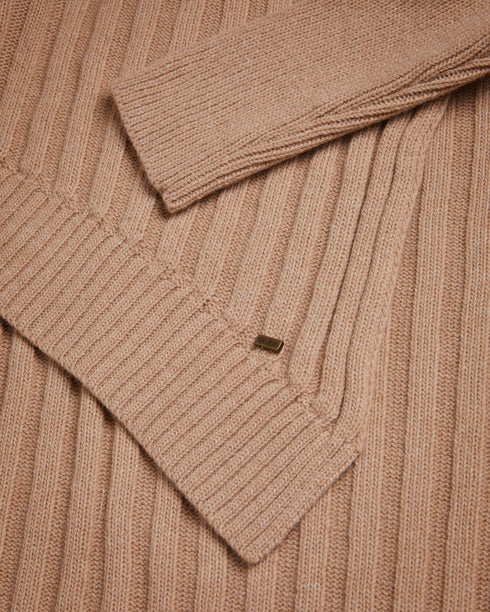 JOILLA-Knitwear-The JOILLA jumper features a funnel neck and long sleeves, with split sides for a unique look. Crafted from a wool and cashmere blend, it is the perfect layer to take you through the winter months. This wardrobe essential works just as well paired with jeans as it does under your favourite leather skirt. The fabric of this product is made with 35% recycled polyamide and 16% recycled wool. Using recycled materials helps divert fabric waste from ending in landfills and reduces our dependence o