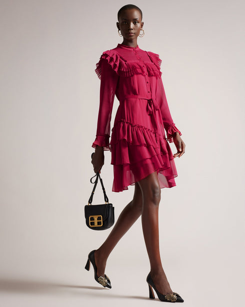 ANASTAI-Dresses-It's all about the ruffles for ANASTAI. This mini shirt dress features ruffle details to add femininity and movement, with an asymmetric hem and a flattering A-line silhouette. Style with chunky boots for a laid back look, or heels for added impact.The fabric of this product is made of 100% recycled polyester. Using recycled polyester helps divert plastic waste from ending in landfills. Shirt dress Mini length Ruffle details Long sleeved Asymmetric ruffled hem Front button fastening Waist ti