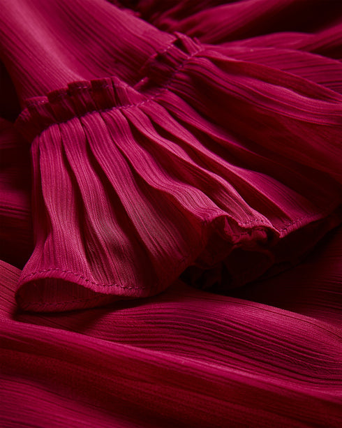 ANASTAI-Dresses-It's all about the ruffles for ANASTAI. This mini shirt dress features ruffle details to add femininity and movement, with an asymmetric hem and a flattering A-line silhouette. Style with chunky boots for a laid back look, or heels for added impact.The fabric of this product is made of 100% recycled polyester. Using recycled polyester helps divert plastic waste from ending in landfills. Shirt dress Mini length Ruffle details Long sleeved Asymmetric ruffled hem Front button fastening Waist ti