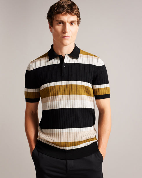 CONFER-Knitwear-Polo shirts are a staple of every man's wardrobe, and CONFER is no exception. Made from a cotton blend and featuring a button placket, it's ideal for wearing with jeans, chinos or tailored trousers while out and about. Finished with a wide stripe print and ribbed knit, it'll fast become a favourite in any style-conscious man's wardrobe. Polo shirt Short sleeved Ribbed knit Cotton blend Wide stripe print Classic collar Button placket George is 6'2" / 1.88m and wears Natural in a Ted size 3- T