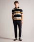 CONFER-Knitwear-Polo shirts are a staple of every man's wardrobe, and CONFER is no exception. Made from a cotton blend and featuring a button placket, it's ideal for wearing with jeans, chinos or tailored trousers while out and about. Finished with a wide stripe print and ribbed knit, it'll fast become a favourite in any style-conscious man's wardrobe. Polo shirt Short sleeved Ribbed knit Cotton blend Wide stripe print Classic collar Button placket George is 6'2" / 1.88m and wears Natural in a Ted size 3- T