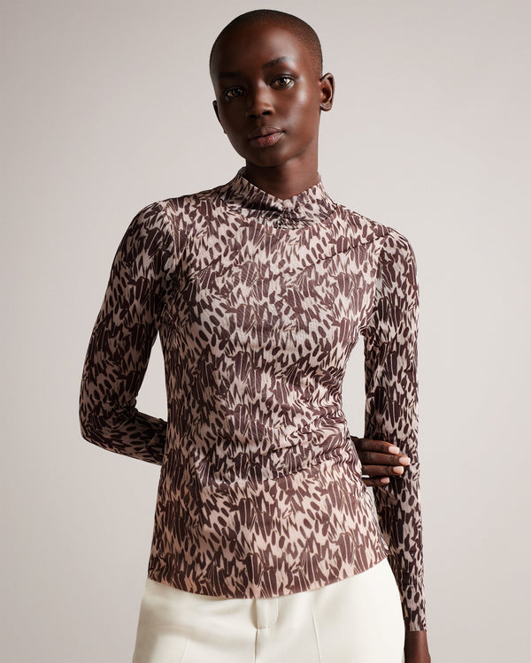 JUMILA-Tops-JUMILA is the ultimate in feminine style. Figure hugging fabric and our exclusive Wings print come together in this dainty top, which features a high neckline, long sleeves, and stretch fabric. This wardrobe staple can be can be worn with anything from tailored trousers to floaty skirts.The fabric of this product is made with 96% recycled polyester. Using recycled polyester helps divert plastic waste from ending in landfills and helps us to reduce our dependency on virgin materials. Fitted mesh
