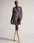 CHERELA-Dresses-It might be downright impossible to not look amazing in CHERELA. With its dropped waist and ruching on the front, pair with a sleek up-do and you're good to go.The fabric of this product is made of 100% recycled polyester. Using recycled polyester helps divert plastic waste from ending in landfills, and helps us to reduce our dependence on virgin materials. Mini dress Long sleeved V-neck Ruched front Ditsy floral print Dropped waist Awuoi is 5'10.5" / 1.79m and wears Light Blue in a Ted size