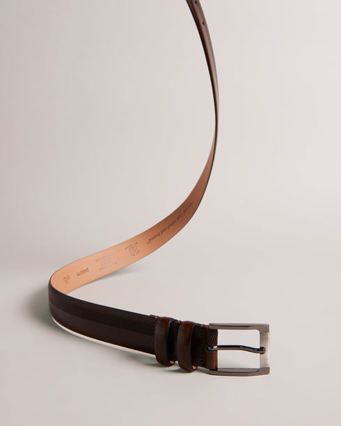 HARVII-Belts-Whether you are headed to the office or enjoying fine dining, HARVII is an essential accessory. Its elegant design features two keeper loops and a tapered edge for a sleek finish. Finely crafted to provide both style and comfort, this leather belt with quickly become a favorite. By purchasing this product, you are supporting responsible leather manufacturing through The Leather Working Group. Belt Bovine leather Geometric etched design Metal buckle Tapered edge Two keeper loops Ted Baker brande