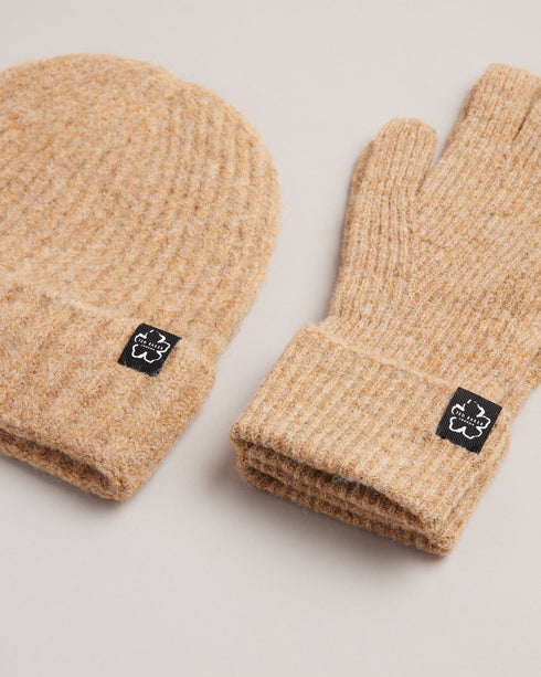 BRITE-Gifts-Give the gift of snug winter mornings with the BRITE Hat and Gloves Set. A soft wool blend and ribbed knit bring a new level of warmth to crisp dog walks and wintery school runs. Hat and gloves set Wool blend Ribbed knit Ted Baker branded Comes in Ted Baker branded gift box- Ted Baker Romania