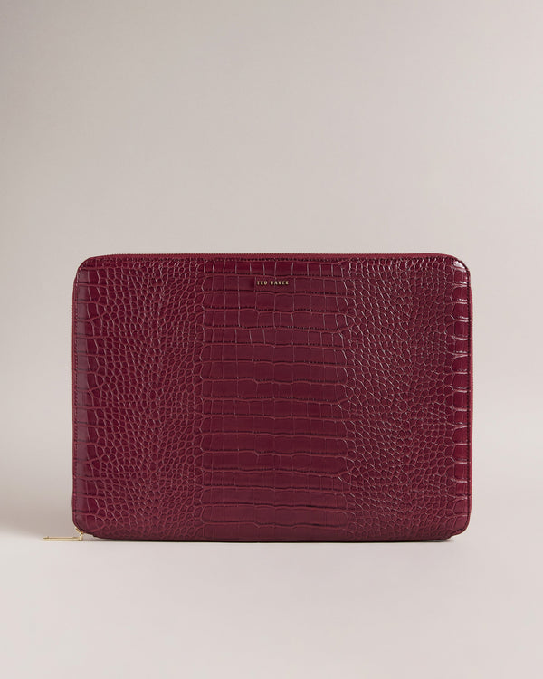 STILA-Gifts-The STILA laptop case is the perfect accessory to complement your style. The imitation croc texture and zip fastening make it easy grab your laptop on the go, while the soft interior lining protects your device from scratches. Laptop case Faux leather Imitation croc texture Zip fastening Fits 15 inch laptop Internal pocket Dimensions: 2.5cm x 27cm x 38cm- Ted Baker Romania