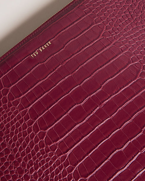 STELIAA-Gifts-The STELIAA laptop case is the perfect accessory to complement your style. The imitation croc texture and zip fastening make it easy grab your laptop on the go, while the soft interior lining protects your device from scratches. Laptop case Faux leather Imitation croc texture Zip fastening Fits 13 inch laptop Internal pocket Dimensions: 2.5cm x 25cm x 35cm- Ted Baker Romania