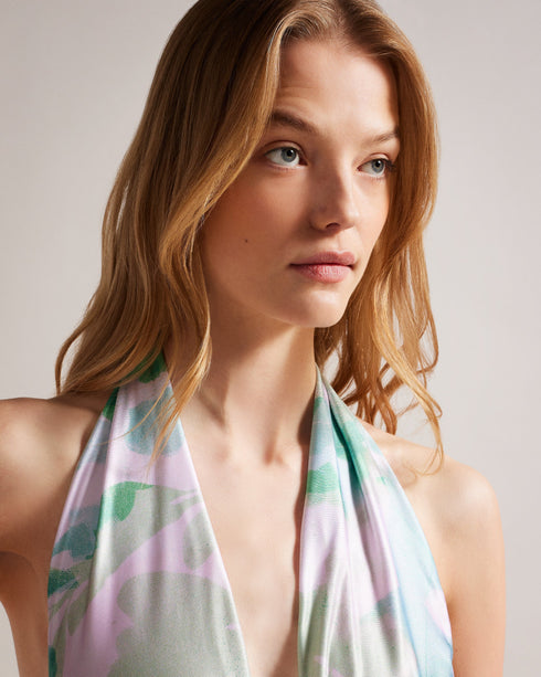 MILENE-Swimwear-One piece, a whole lot of style. The MILENE swimsuit is a versatile piece with multiple ways to wear. Its self-tie detail makes it easy to ensure a secure fit while the abstract print keeps it fun and eye-catching. Swimming costume One piece Multiple ways to wear Self tie Abstract print Roos is 5'11" / 1.80m and wears Green in a Ted size 1- Ted Baker Romania