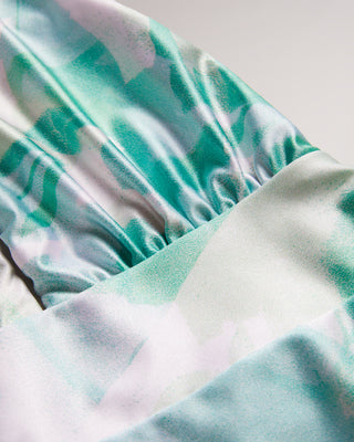 MILENE-Swimwear-One piece, a whole lot of style. The MILENE swimsuit is a versatile piece with multiple ways to wear. Its self-tie detail makes it easy to ensure a secure fit while the abstract print keeps it fun and eye-catching. Swimming costume One piece Multiple ways to wear Self tie Abstract print Roos is 5'11" / 1.80m and wears Green in a Ted size 1- Ted Baker Romania