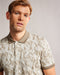 PLASTA-Tops-Take it easy in this super soft polo shirt. PLASTA has a comfortable fit and a classic silhouette that's always in style.By choosing Ted Baker cotton products, you're supporting our investment in the Better Cotton Initiative's mission. This product is sourced via a system of mass balance and therefore may not contain Better Cotton. Polo shirt Short sleeved Floral print Solid trims Button fastening Classic collar Elliot is 6'2" / 1.88m and wears Stone in a Ted size 3- Ted Baker Romania