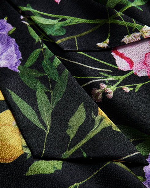 DEMITRI-Tops-The ultimate wardrobe staple, DEMITRI has it all. The scattered bouquet print and oversized self-tie fastening are the perfect combination for a stylish look that will elevate whatever jeans, skirt or trousers you pair with it. The fabric of this product is made with 100% recycled polyester. Using recycled polyester helps divert plastic waste from ending in landfills, and helps us to reduce our dependence on virgin materials. Sleeveless top Scattered bouquet print Cowl neck Oversized self-tie f