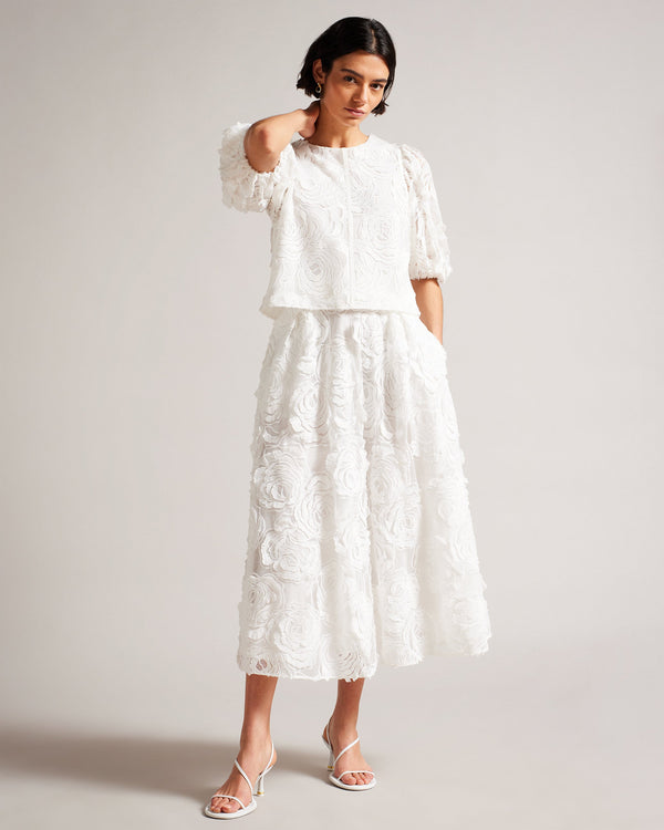 LOUELAA-Skirts-Making a statement is a breeze in LOUELAA. Pleats, pockets, and a rose-textured lace on this midi skirt are just a few of the ingredients that add up to an irresistible look. Midi skirt A-line Pleated Rose textured lace Zip fastening Lined Pockets Chae is 5'9.5" / 1.77m and wears White in a Ted size 1- Ted Baker Romania