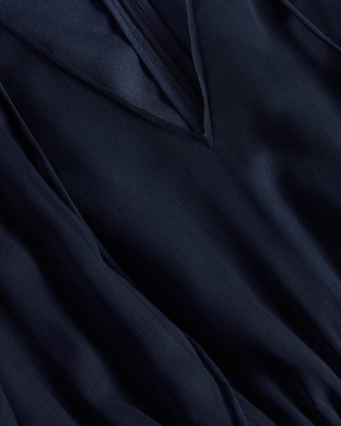 GIGGIE-Dresses-Add a touch of retro style to your wardrobe with GIGGIE. This dress features a fit and flare silhouette, with sheer fluted sleeves and a ruffle tiered skirt that are sure to make you stand out at your next event.The shell of this product is made of 100% recycled polyester. Using recycled polyester helps divert plastic waste from ending in landfills and helps us to reduce our dependency on virgin materials. Mini dress Tiered skirt with ruffles Fit and flare Sheer fluted sleeves Neck tie V neck