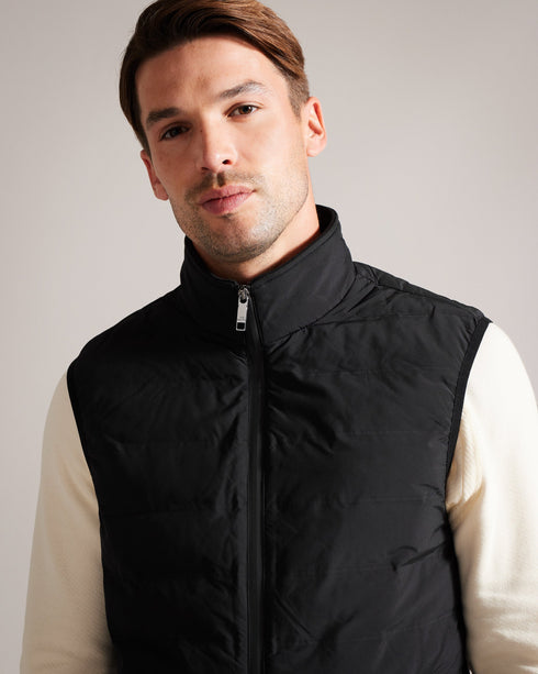 NEWWARK-Outerwear-Say yes to effortless style with the NEWWARK gilet. A gilet is the perfect lightweight coverup for warmer weather and this one's funnel neck and padding keep out the breeze. Gilet Pockets Zip fastening Funnel neck Padded Magnolia label- Ted Baker Romania