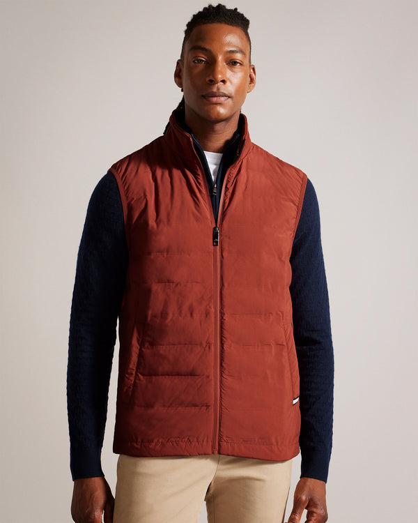 NEWWARK-Outerwear-Say yes to effortless style with the NEWWARK gilet. A gilet is the perfect lightweight coverup for warmer weather and this one's funnel neck and padding keep out the breeze. Gilet Pockets Zip fastening Funnel neck Padded Magnolia label- Ted Baker Romania