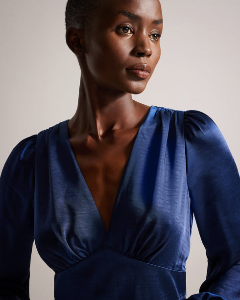 DANIIA-Dresses-Plunging neckline, long sleeves, and a split hem? DANIIA is ready for anything. This delightful satin midi dress features a plunging V-neck, A-line and split hem. Long blouson sleeves add elegance that completes the look.The fabric of this product is made with 100% recycled polyester. Using recycled polyester helps divert plastic waste from ending in landfills, and helps us to reduce our dependence on virgin materials. Satin midi dress Plunging V-neck A-line Split hem Long blouson sleeves Bac