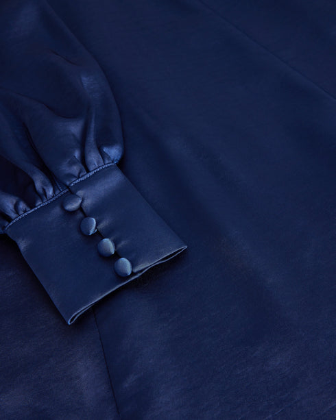 DANIIA-Dresses-Plunging neckline, long sleeves, and a split hem? DANIIA is ready for anything. This delightful satin midi dress features a plunging V-neck, A-line and split hem. Long blouson sleeves add elegance that completes the look.The fabric of this product is made with 100% recycled polyester. Using recycled polyester helps divert plastic waste from ending in landfills, and helps us to reduce our dependence on virgin materials. Satin midi dress Plunging V-neck A-line Split hem Long blouson sleeves Bac