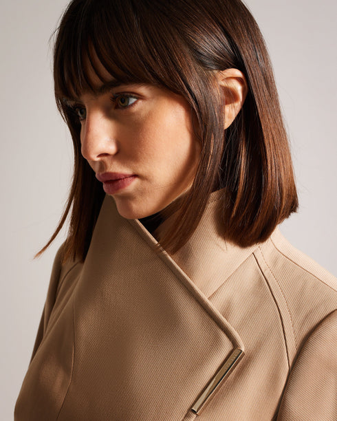 ROSIAAS-Outerwear-Stay chic in any weather with our ROSIAAS coat. Made of a cosy cotton blend, it features a wrap front and self-tie belt, accented by a metal hardware trim. Perfect for navigating the city streets or braving the rain, this trench is both practical and fashionable. By choosing Ted Baker cotton products, you're supporting our investment in the Better Cotton Initiative's mission. This product is sourced via a system of mass balance and therefore may not contain Better Cotton. Trench coat Mini