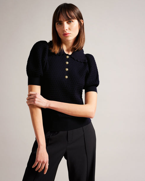 REANNIA-Knitwear-Short puff sleeves and a texture knit make REANNIA go the extra mile, while the faux pearl buttons give it a little extra flair. Stretch fabric will take you through the day with ease. Polo top Short puff sleeves Faux pearl buttons Textured knit Scalloped collar Stretch fabric Julia is 5'10" / 1.78m and wears Dark Blue in a Ted size 1- Ted Baker Romania