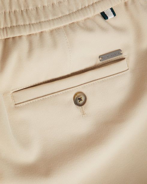 RODNY-Trousers-Make an entrance in the RODNY trousers. Exquisitely tailored and an excellent addition to any man's wardrobe, this pair of trousers will make your mark on the boardroom. Trousers Slim fit Zip and button fastening Elasticated waist Pockets Braided piping Joseph is 6'1" / 1.85m and wears Navy in 32 R- Ted Baker Romania