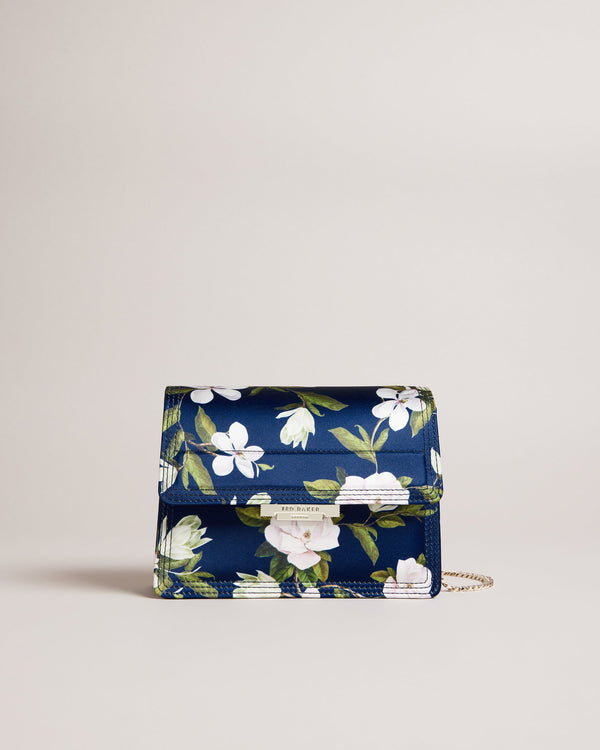 JENIA-Bags-Perfect for adding a pop of colour to any outfit, JENIA features a beautiful floral print and a versatile chain shoulder strap for a chic and convenient way to carry your essentials. Its push lock closure adds a touch of sophistication to complete the look, so you can wow from the office to the bar. Crossbody bag Chain shoulder strap Floral print Push lock closure Logo engraved hardware Dimensions: 7cm x 13cm x 20cm- Ted Baker Romania