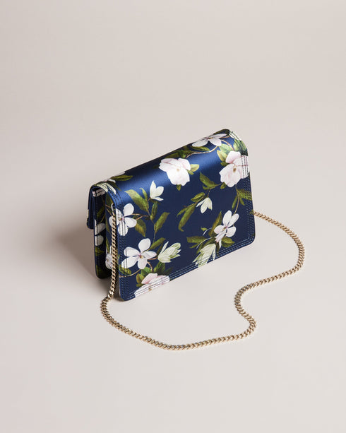 JENIA-Bags-Perfect for adding a pop of colour to any outfit, JENIA features a beautiful floral print and a versatile chain shoulder strap for a chic and convenient way to carry your essentials. Its push lock closure adds a touch of sophistication to complete the look, so you can wow from the office to the bar. Crossbody bag Chain shoulder strap Floral print Push lock closure Logo engraved hardware Dimensions: 7cm x 13cm x 20cm- Ted Baker Romania