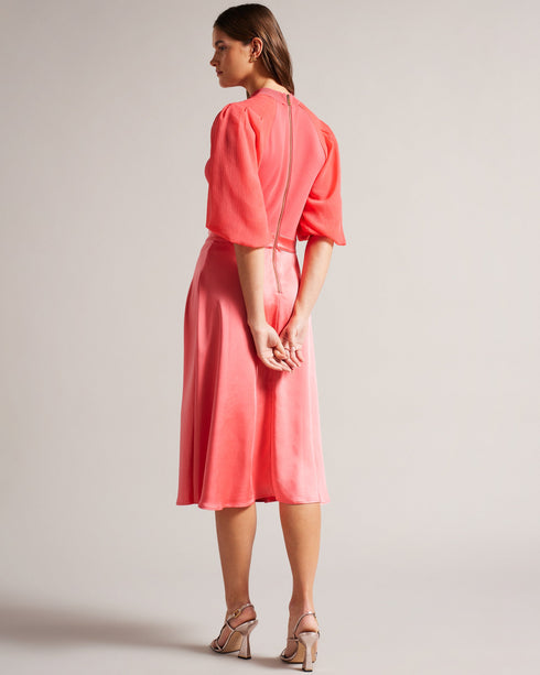 BRONTEI-Dresses-Experience a new dimension of feminine style with this midi dress. BRONTEI's sheer puff sleeves take the look to another level of sophistication, while the knit bodice and high neck are tastefully flirty. The knit fabric of this product is made with 66% recycled viscose, and the woven fabric is made with 52% recycled polyester. Using recycled materials helps divert fabric waste from ending in landfills and reduces our dependence on virgin materials. Midi dress Sheer puff sleeves Knitted bodi