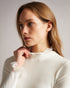 DVANA-Knitwear-For a frilling addition to your smart-casual wardrobe, add DVANA to your style repertoire. Not any ordinary knit, this ribbed jumper is given a little extra in the form of a frill detailing on the neckline and sleeves. Fitted jumper Cashmere blend High neck Long sleeves Frilled trims Ribbed knit- Ted Baker Romania