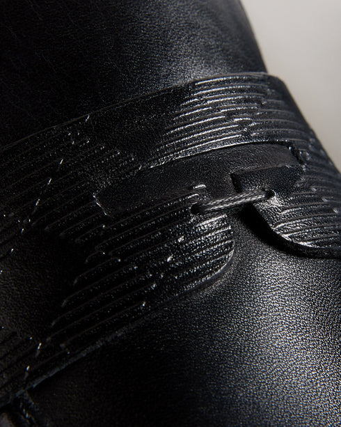 ADLERRC-Shoes-Step into timeless elegance with our ADLERRC loafers. Crafted from premium leather, they feature a sleek almond toe design that adds a touch of sophistication to any ensemble. Whether you're dressing up for a formal occasion or adding a touch of refinement to your everyday look, they're the perfect choice for the modern gentleman who appreciates classic style with a contemporary twist. Saddle loafers Leather upper Almond toe Slip on Resin sole Debossed stripe details- Ted Baker Romania